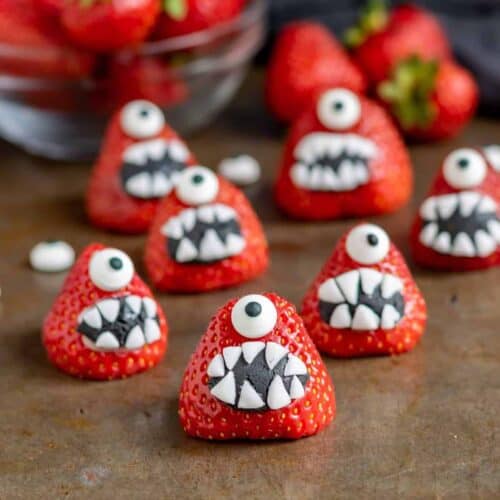 Strawberries decorated to look like cute one-eyed monsters.