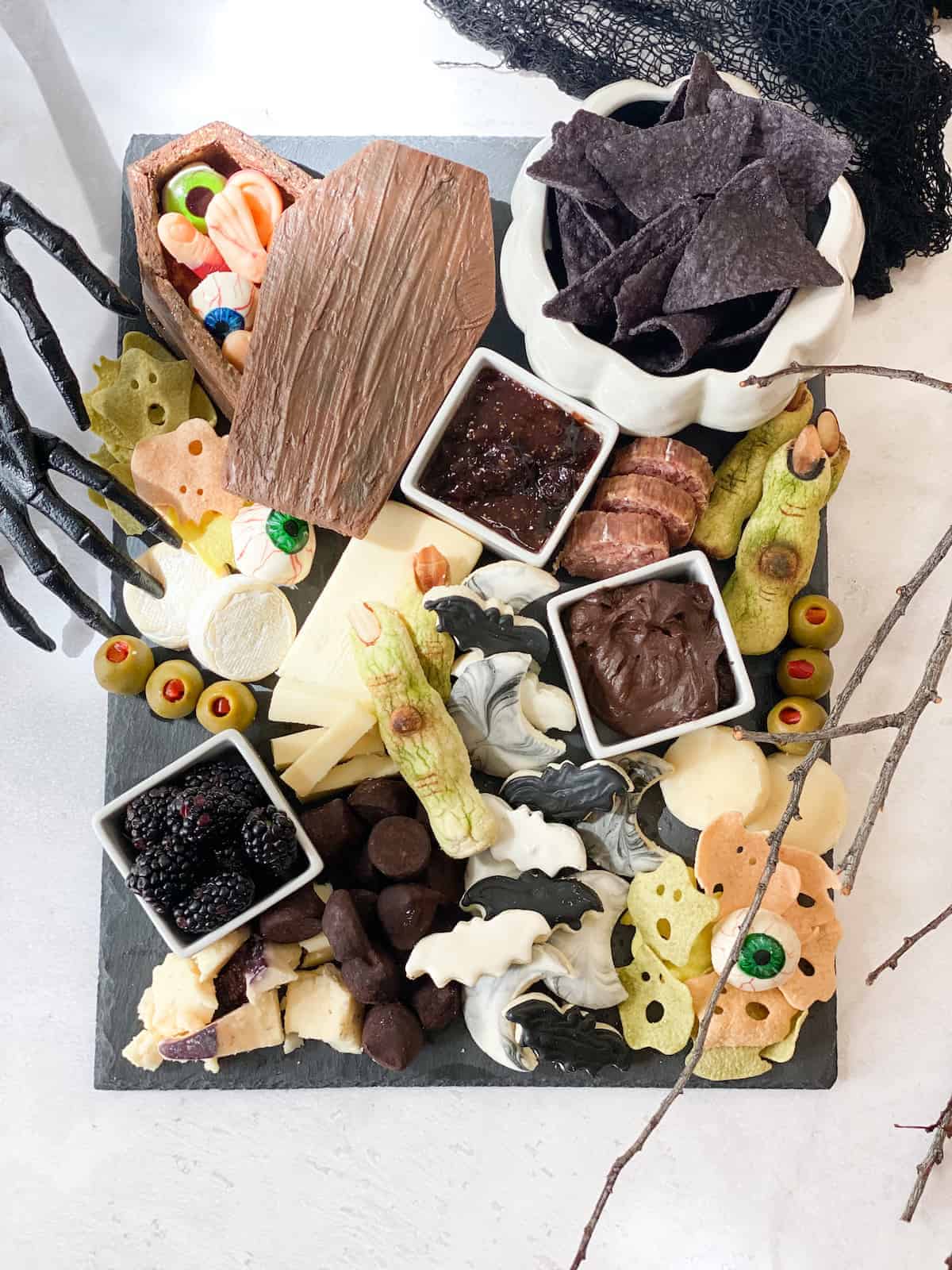 A charcuterie board filled with fun and eerie halloween treats!