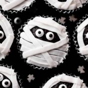 Close-up of black and white cupcakes that looks like mummies.