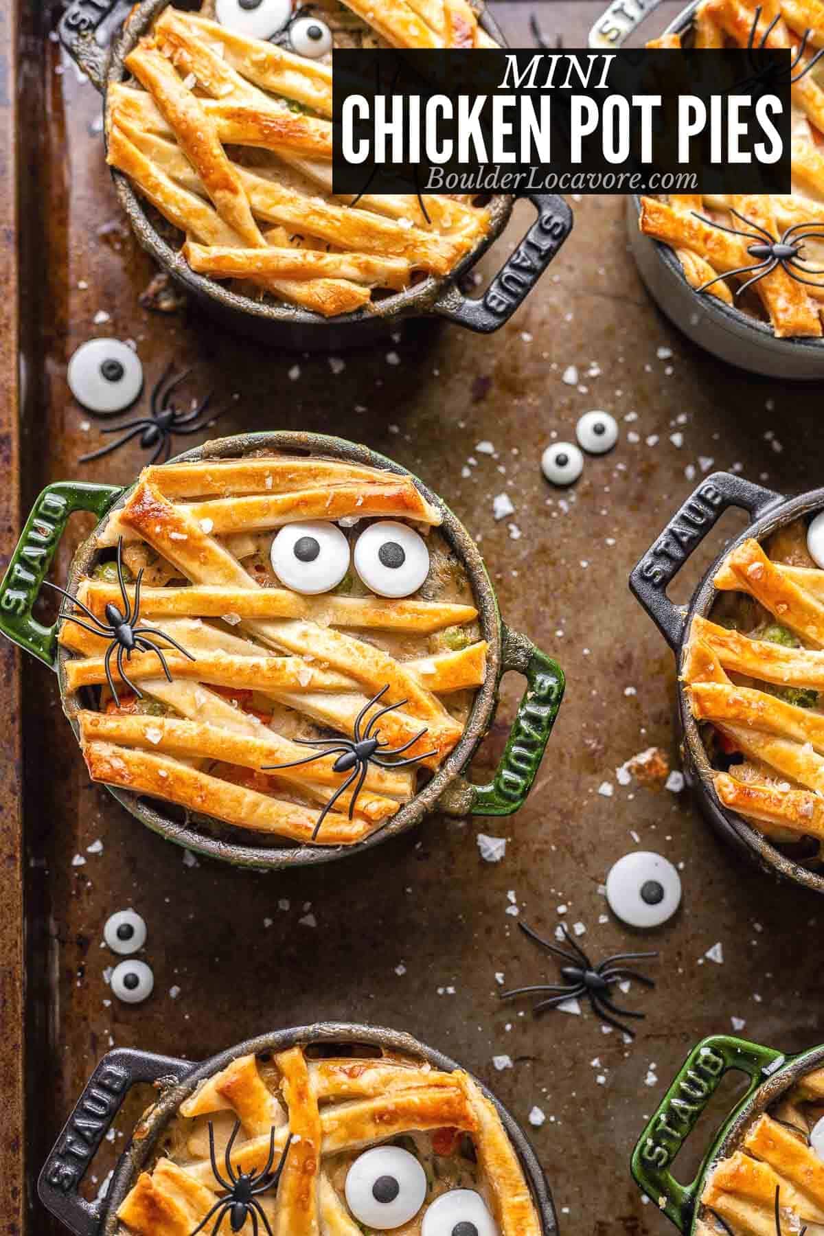 Mini pot pies that have been decorated to form mini monsters.