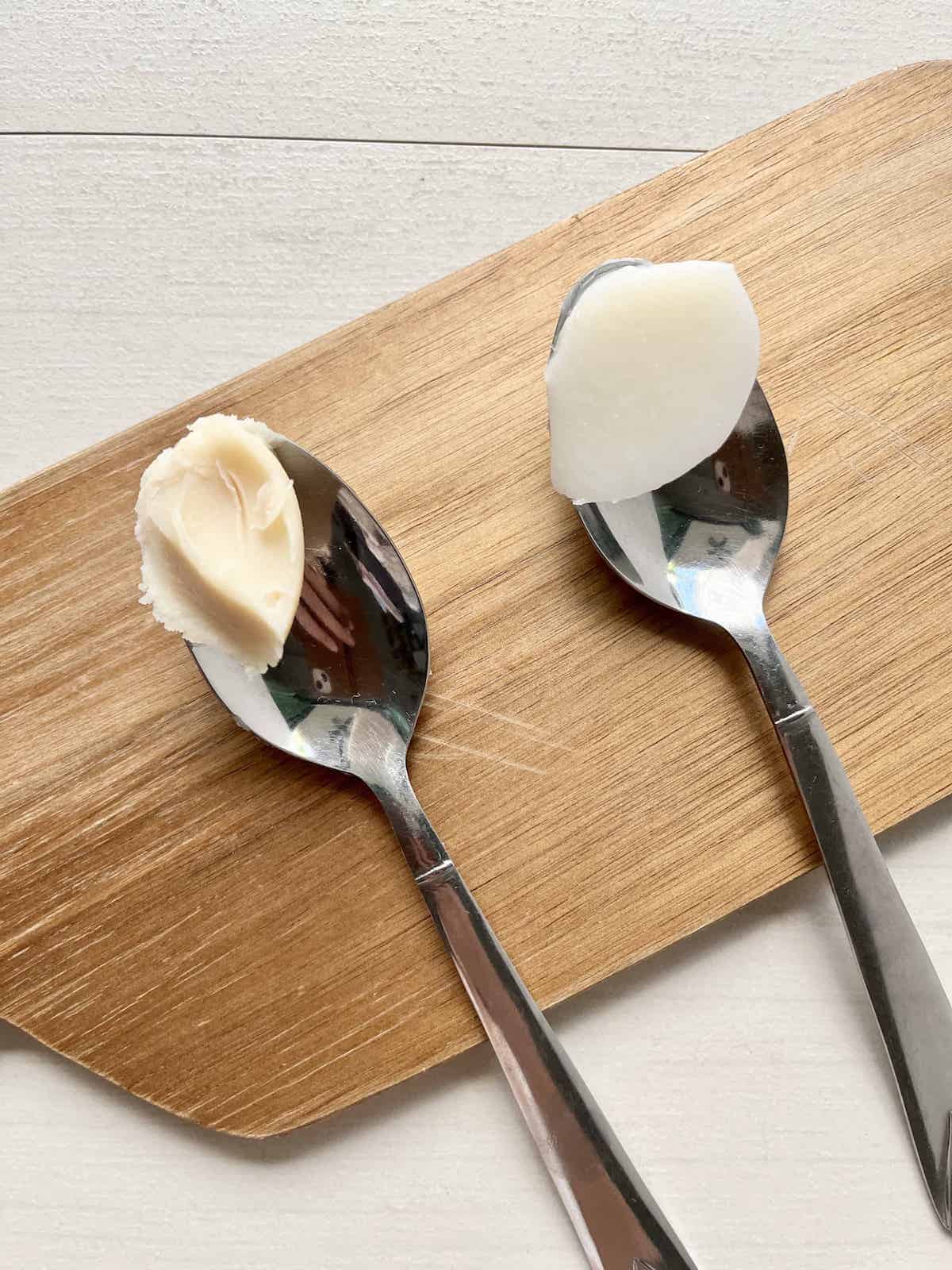 A spoonful of rancid lard next to a spoonful of freshly rendered white lard.