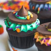 Close-up of a cupcake with green frosting like a witch's hat.