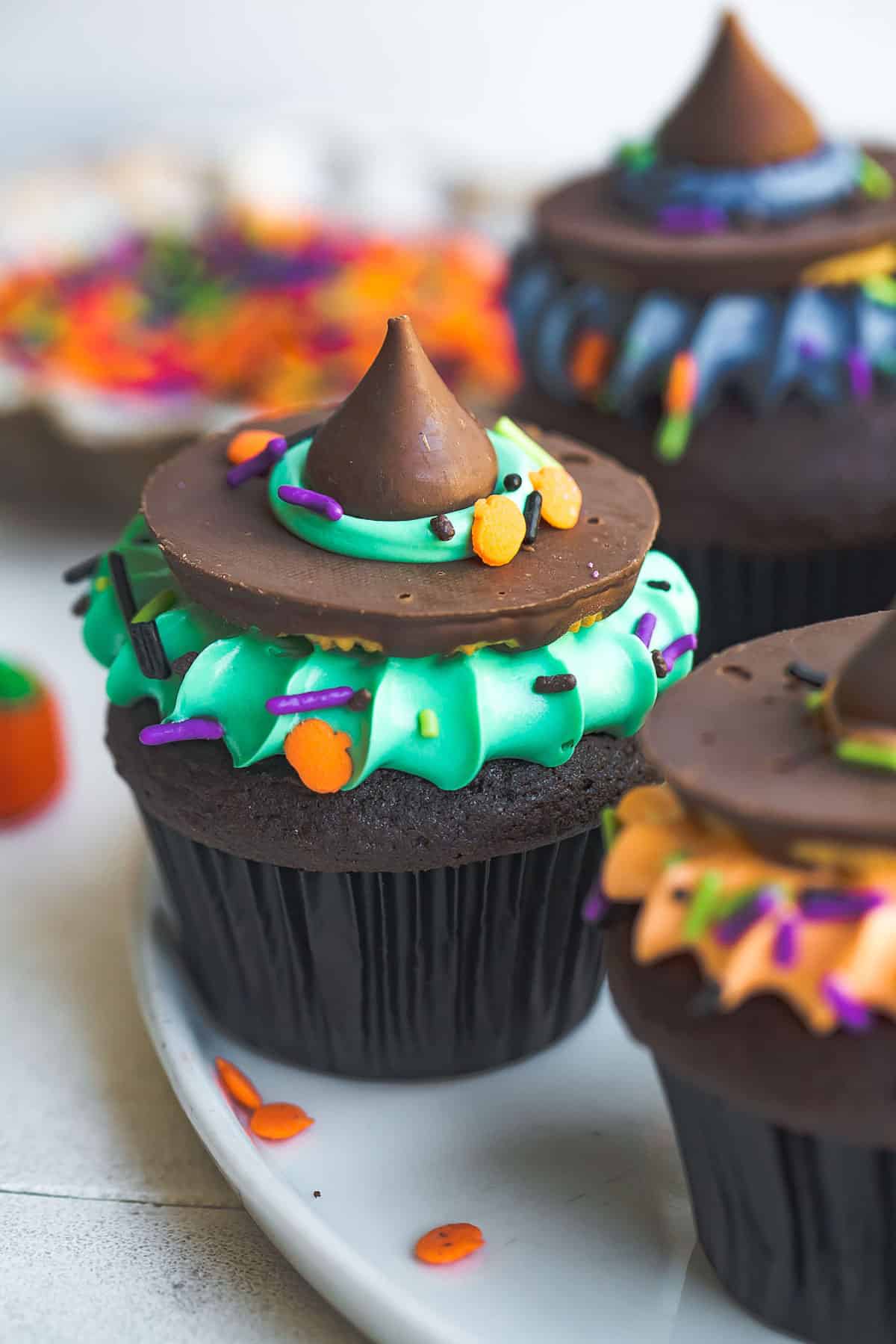 Close-up of a cupcake with green frosting like a witch's hat.