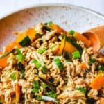 Close-up of a bowl of Kabocha Squash, chicken and enoki mushroom stew.