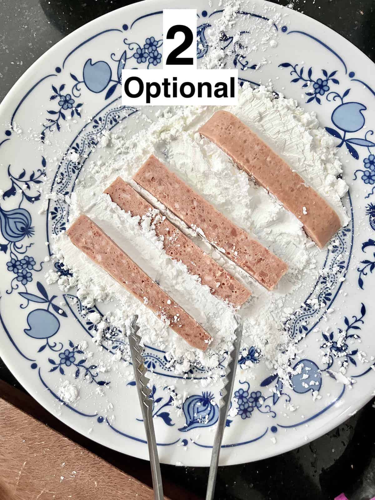 https://www.greedygirlgourmet.com/wp-content/uploads/2022/11/dipping-spam-in-flour.jpg