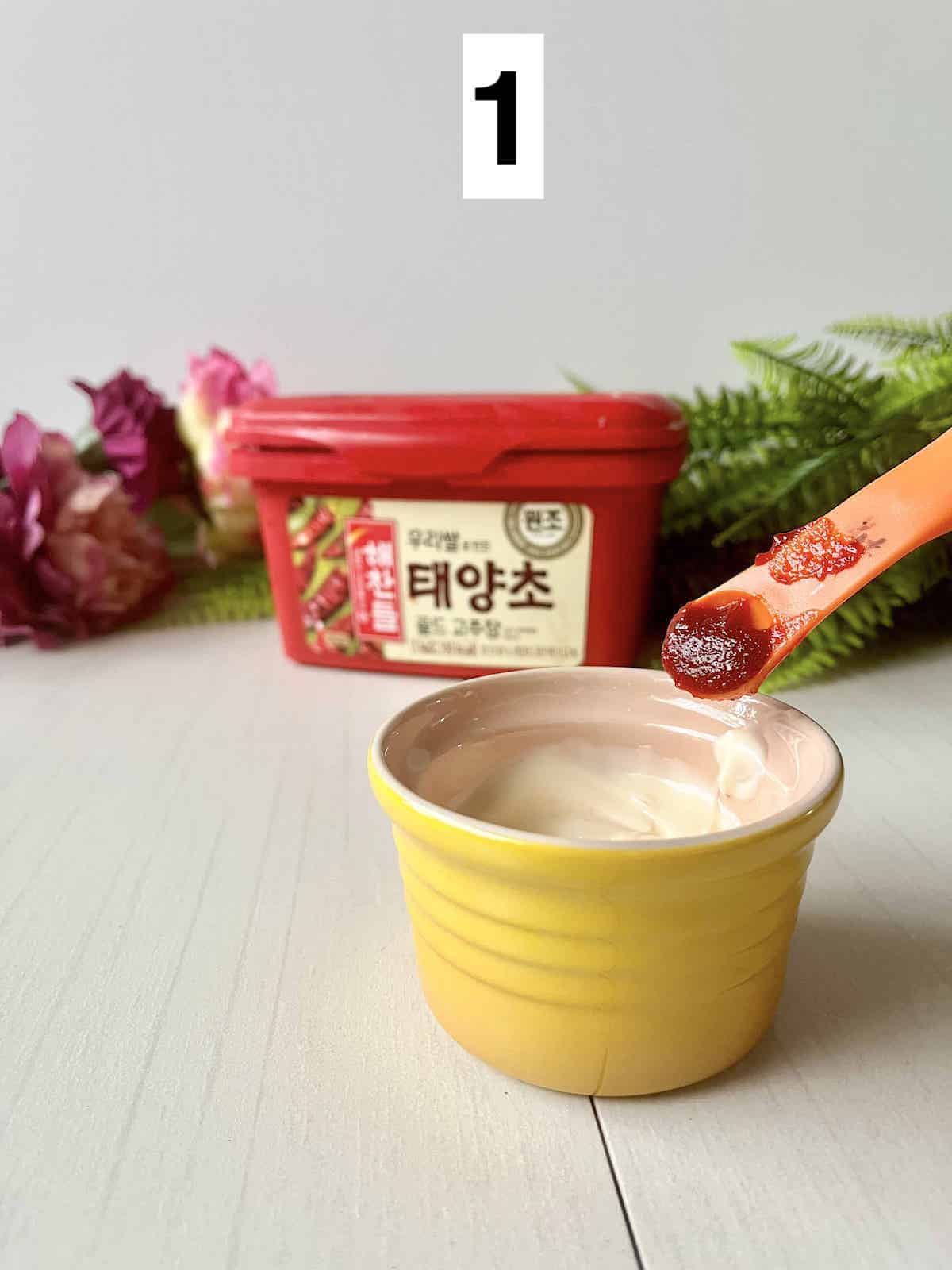 Adding a teaspoon of Gochujang Korean red pepper sauce into mayonnaise.