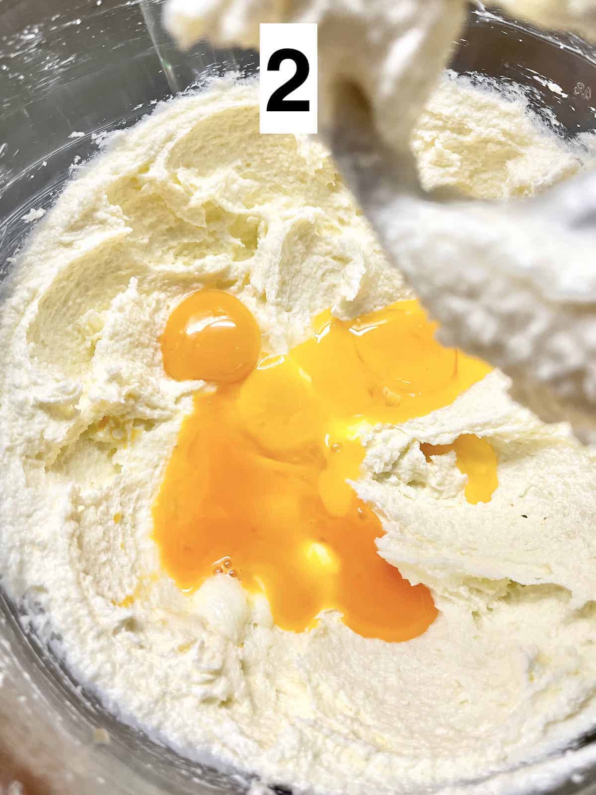 Close-up of egg yolks on creamed dough.