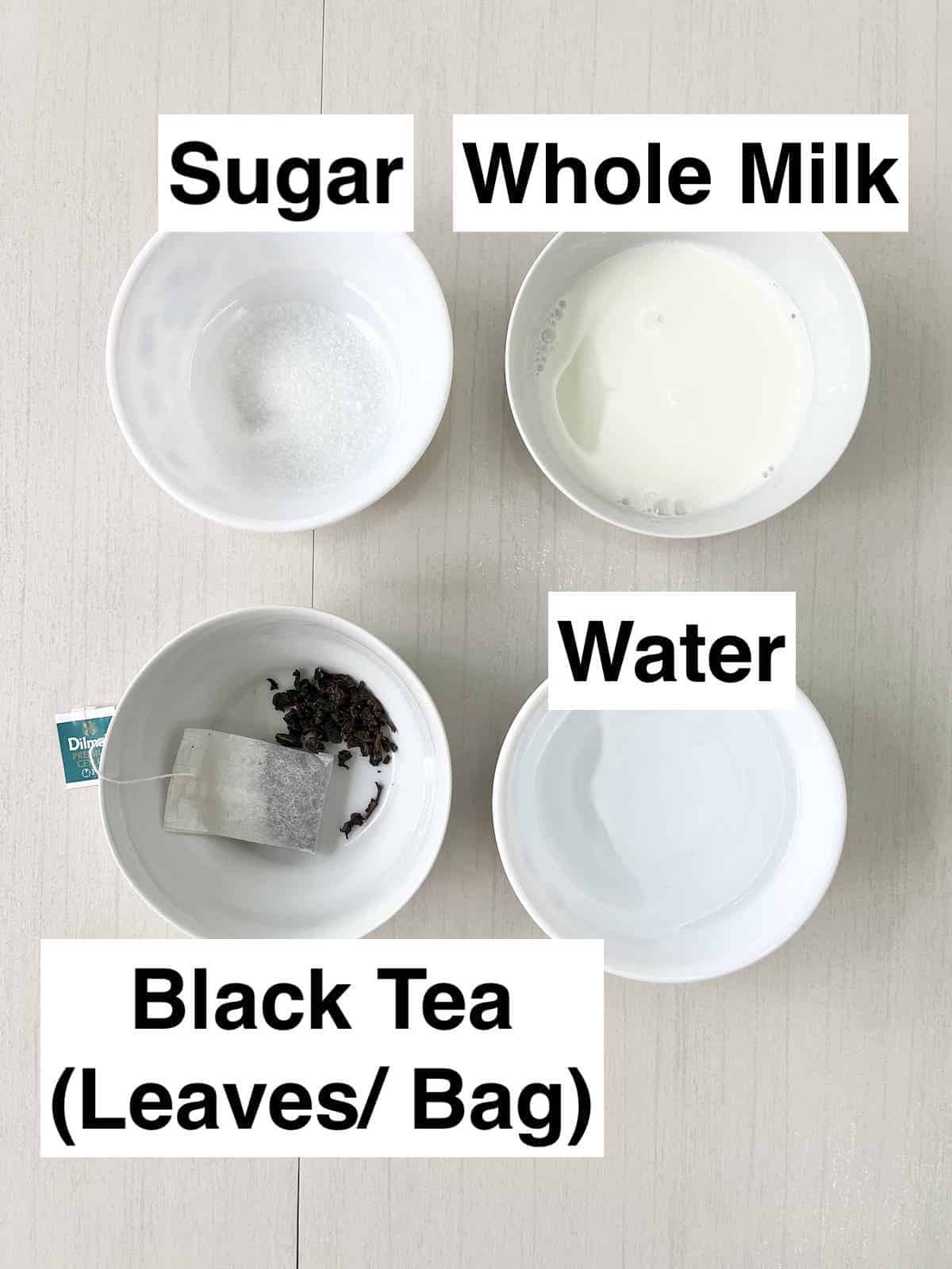 A bowl of water, milk, sugar and black tea.