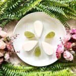 A plate of coconut jelly and pandan jelly arranged as a flower.