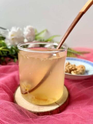 A glass of Japanese yuzu tea in a glass cup.