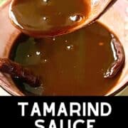 Scooping up sweet & Sour Indian Tamarind Sauce from a bowl.