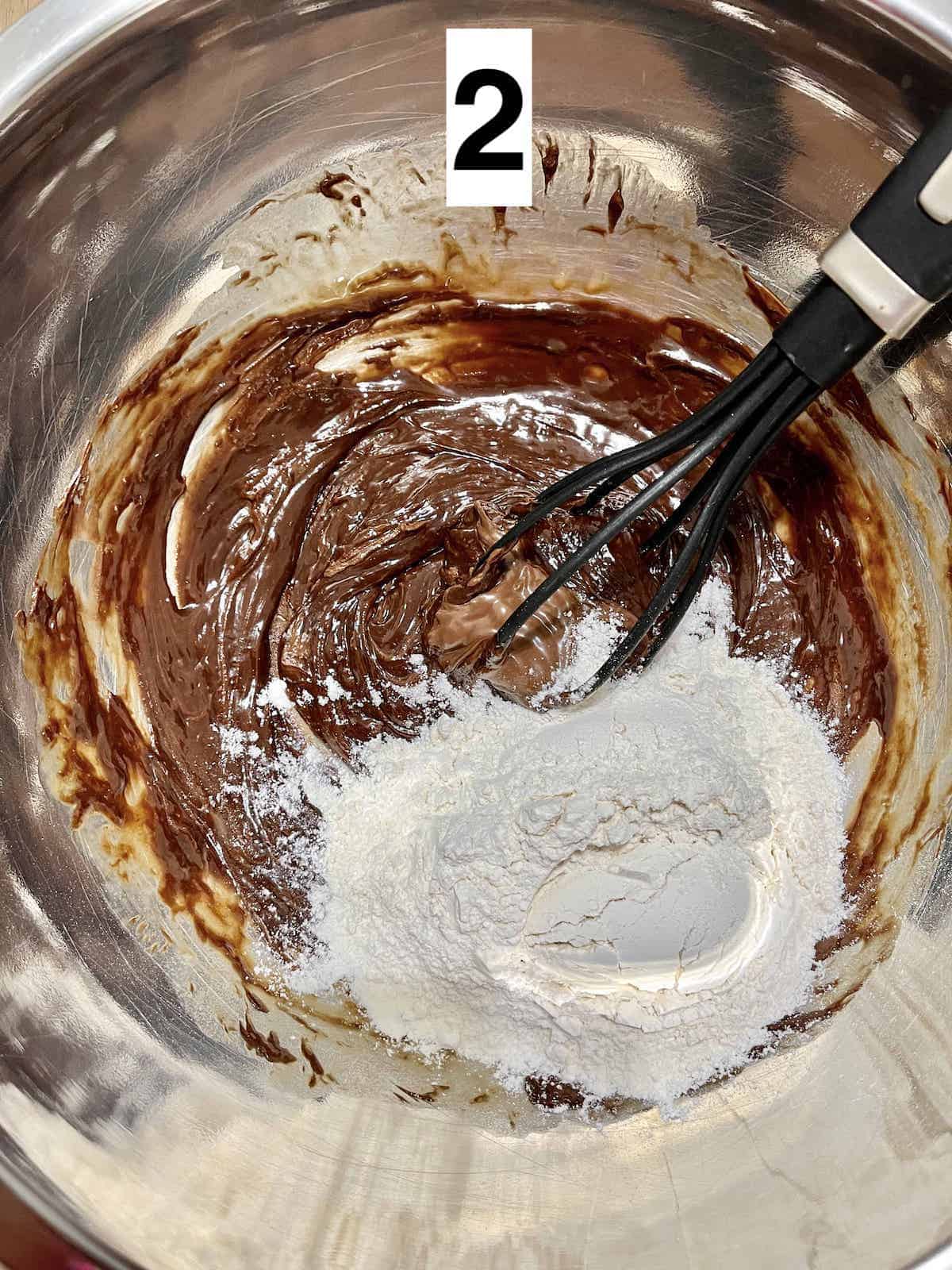 Whisking together Nutella hazelnut chocolate spread and flour.