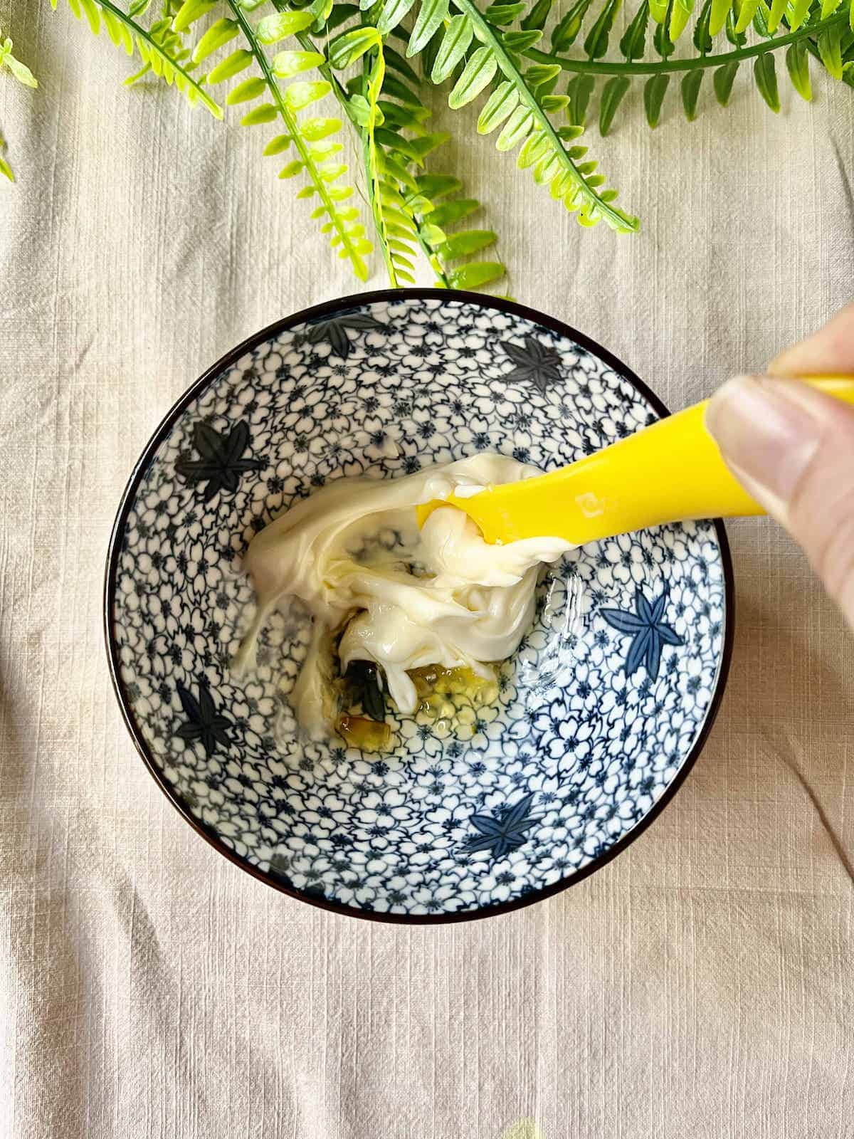 Stirring mayonnaise and Yuzu Marmalade together.