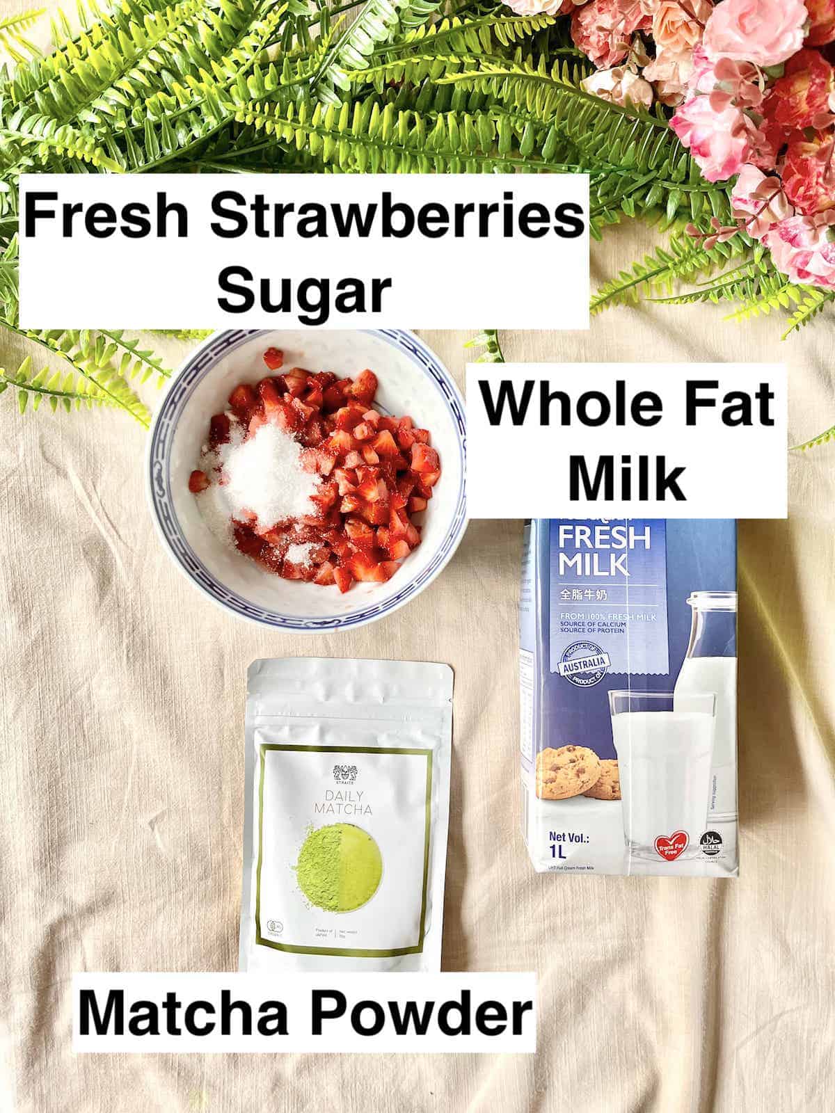 A bowl of cut up strawberries with sugar next to milk and green tea powder.