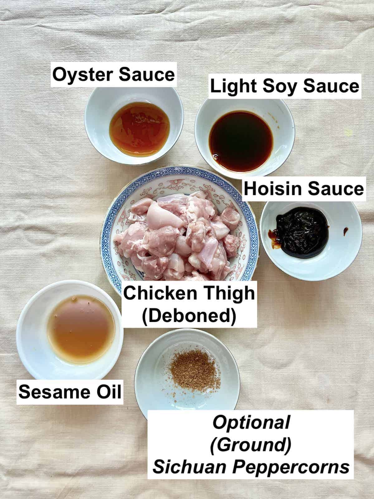 The ingredients for Chinese chicken kebab on a tablecloth.