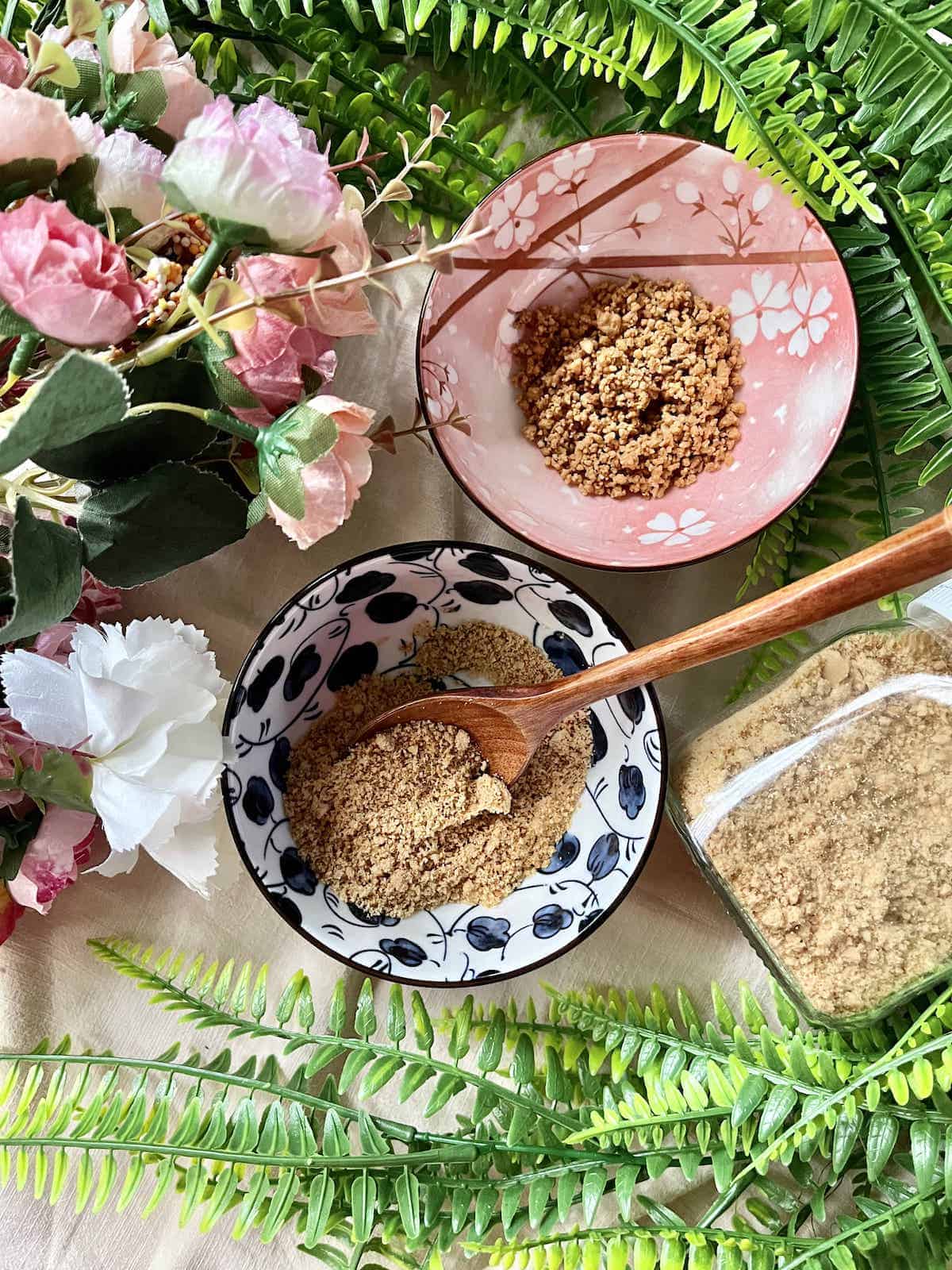 2 bowls of ground peanuts, of different textures.