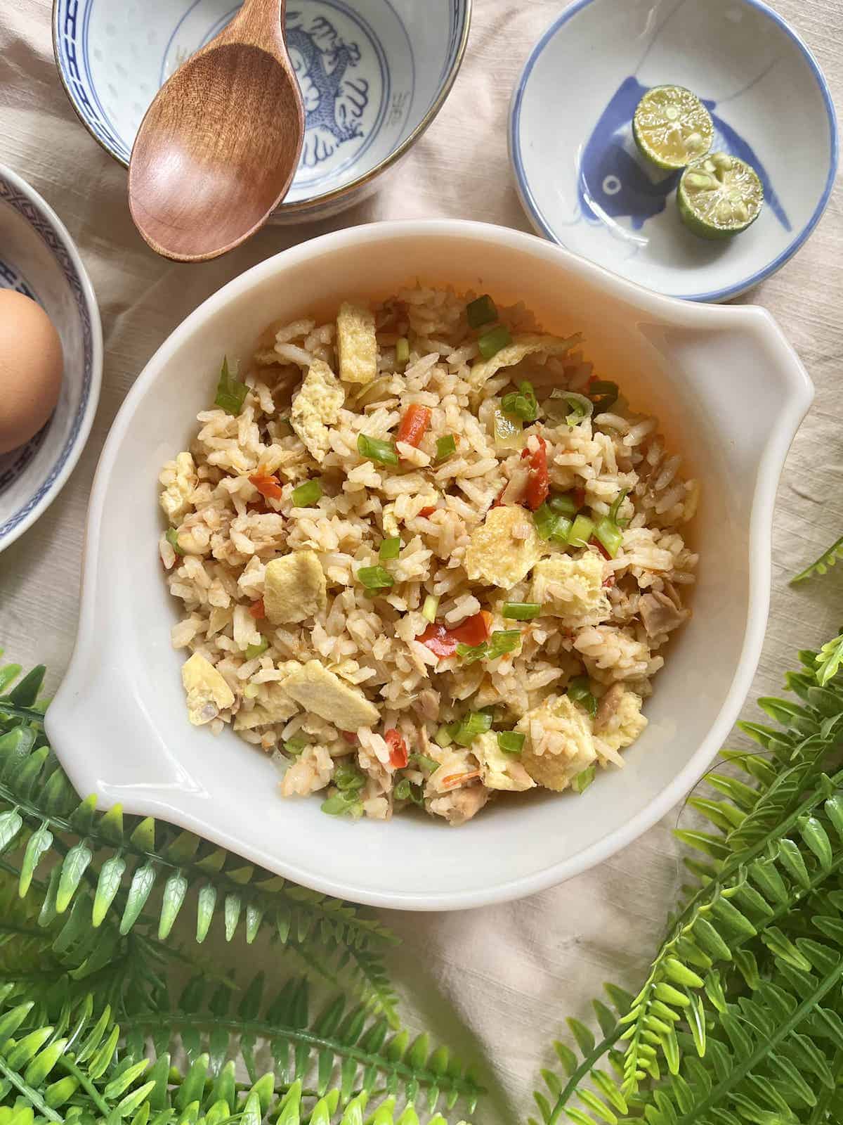 Overhead shot of a big bowl of homemade spicy Thai-inspired fried rice.