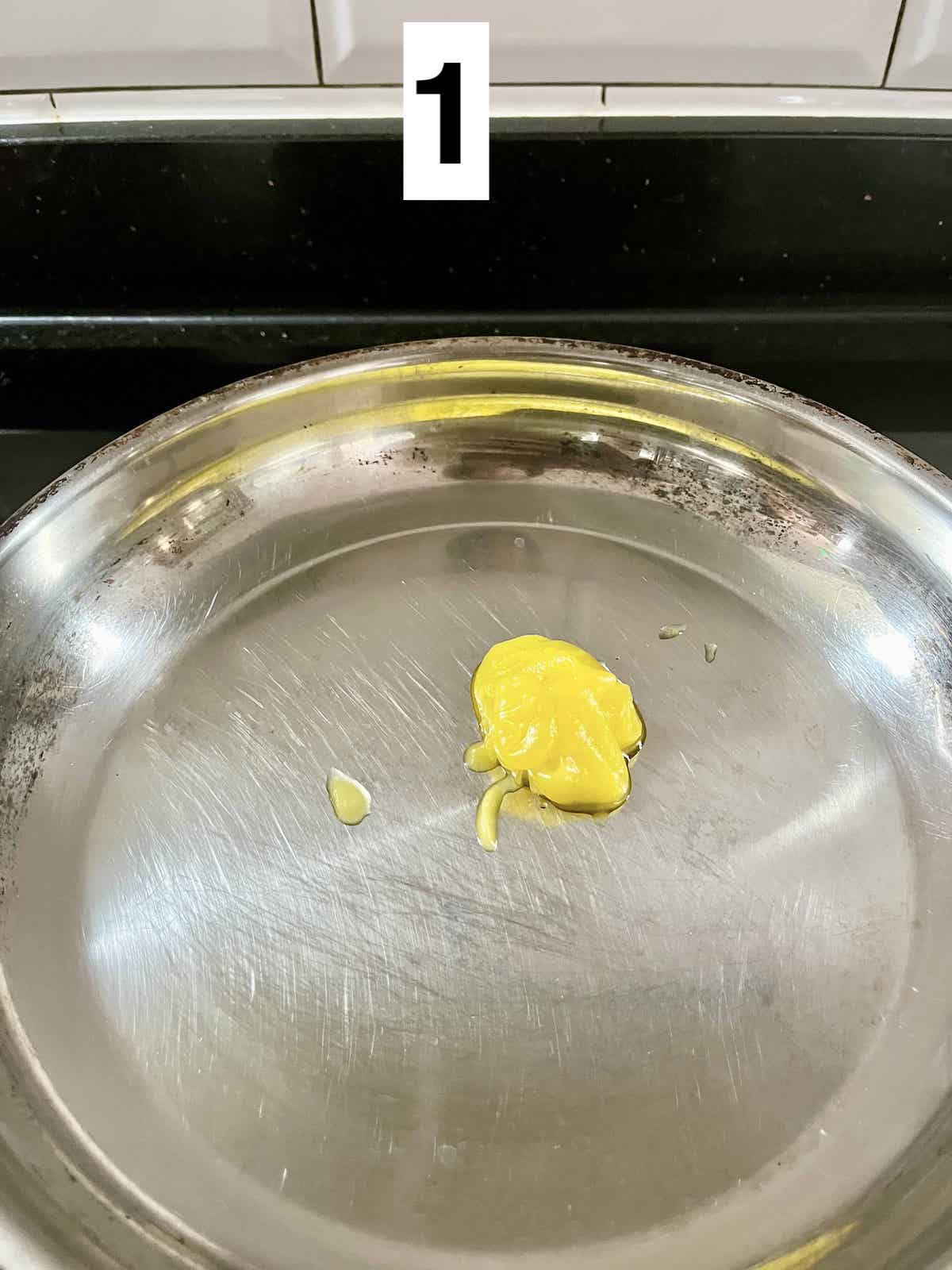 Melting butter in a pan.