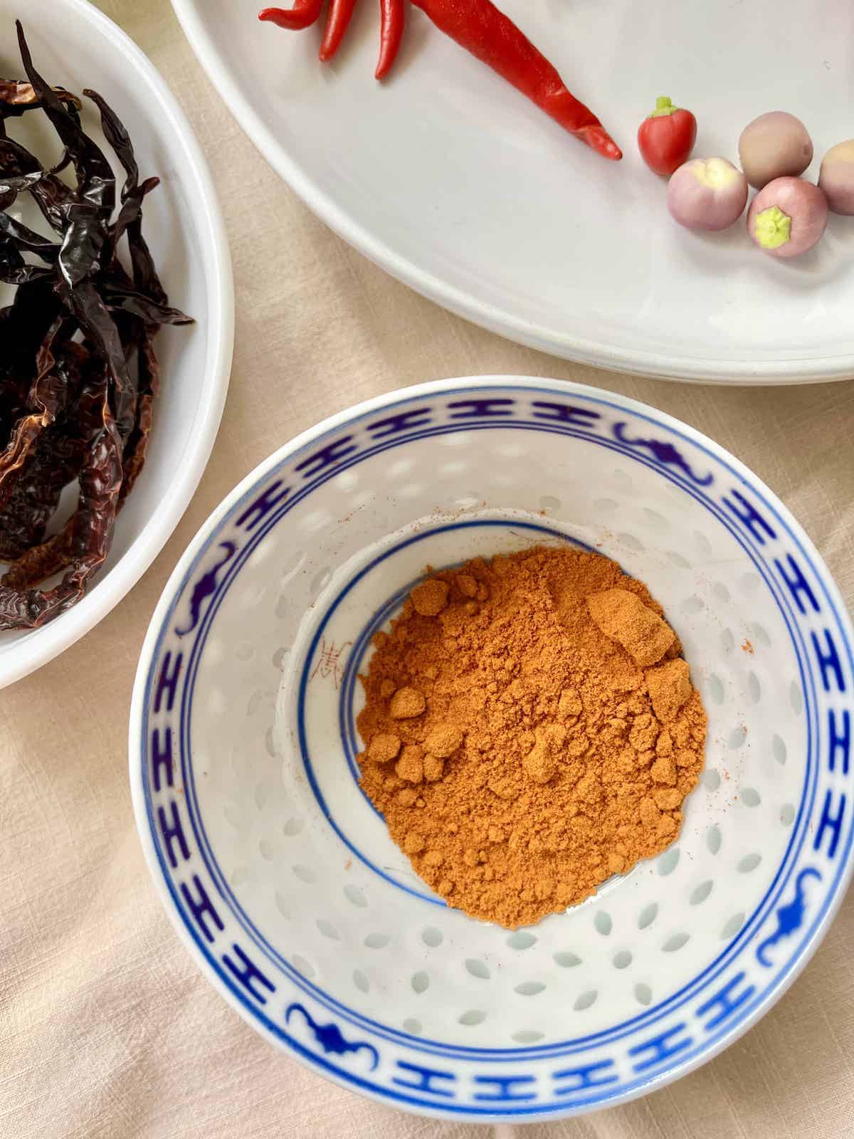 A bowl of dried red chili powder.