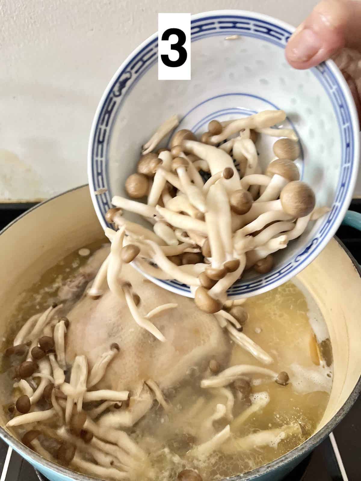Adding brown beech mushrooms to chicken soup with abalone.