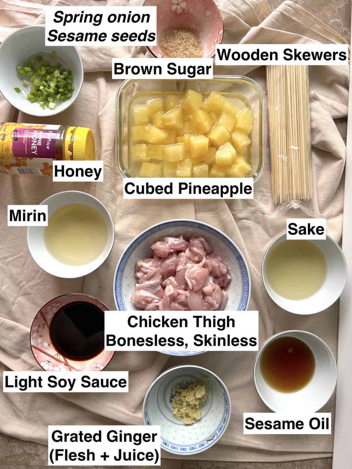 The ingredients for chicken teriyaki sticks on a linen cloth.