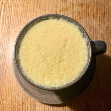 Overhead shot of a mug full of Golden Latte with Turmeric and Honey.