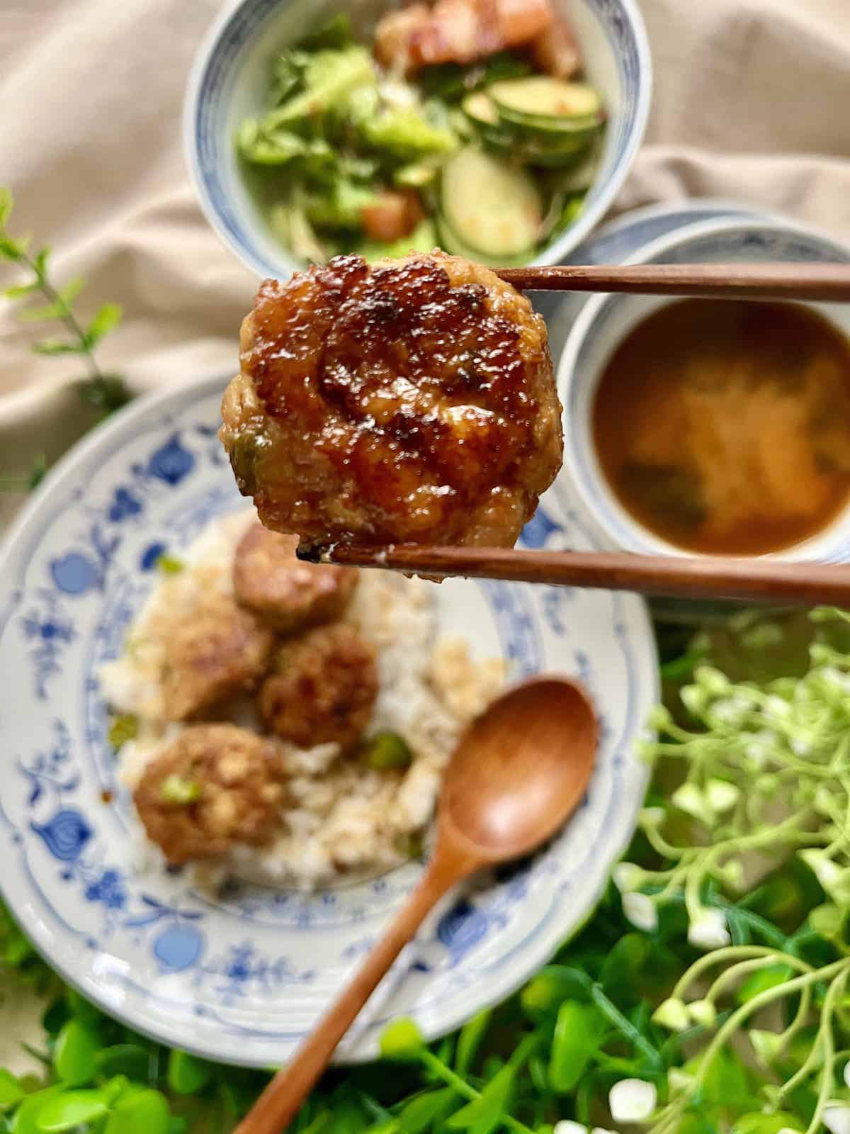 Chicken teriyaki meatballs, rice, and salad on the side.