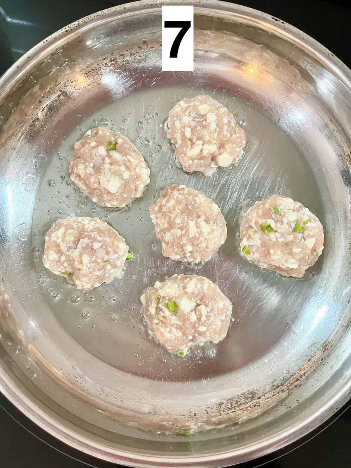6 chicken tofu meatballs in a silver pan.