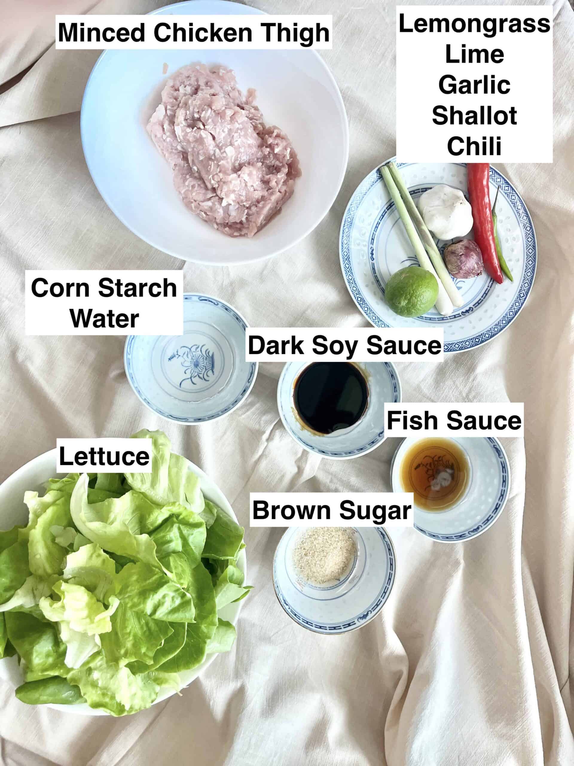 The ingredients for Vietnamese Lemongrass Chicken Lettuce Wrap on a linen cloth.