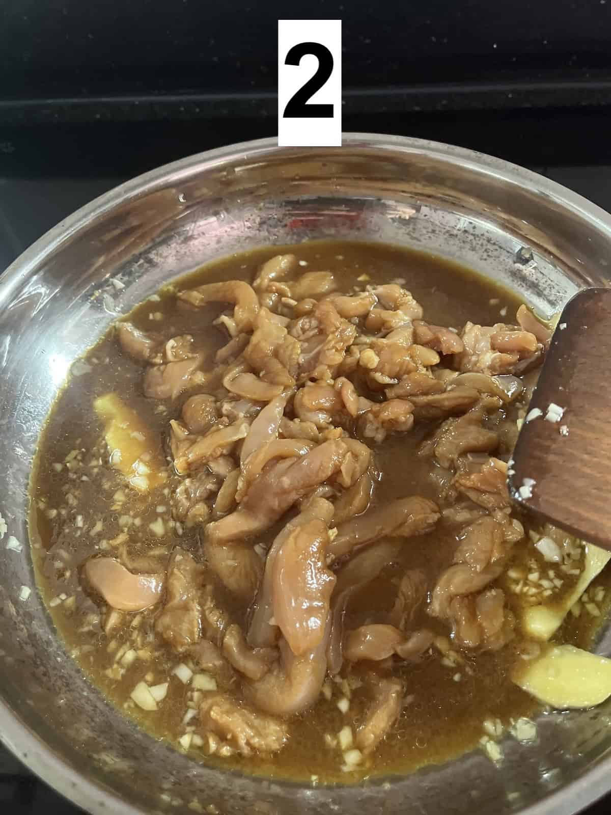 Cooking chicken filets in teriyaki sauce.