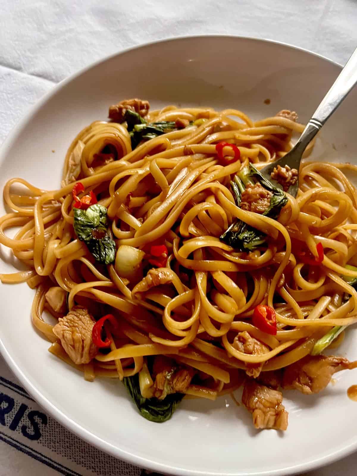 Chicken Lo Mein Spaghetti Noodles coated in a savory sauce.
