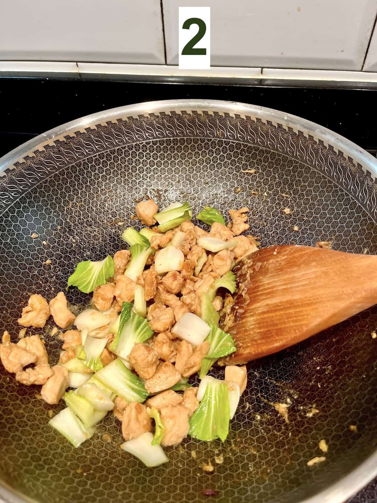 Stir frying veggie stems for chicken lo mein.