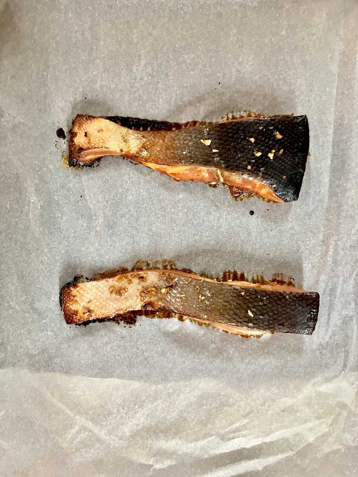 Baked Asian style fish on baking paper.