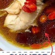Close-up of chicken drumstick and goji berry ginseng soup.