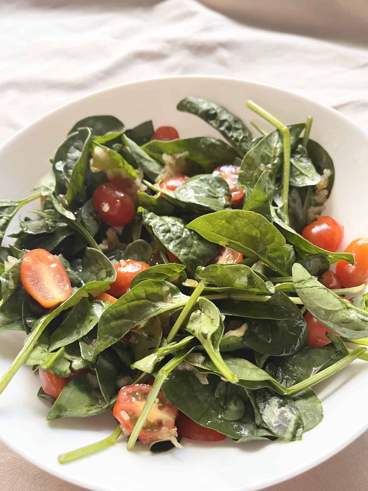 Japanese spinach and cherry tomato salad with onion dressing.