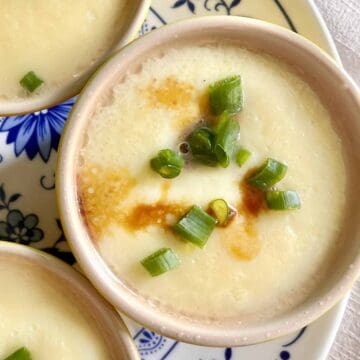 Chinese steamed egg with soy sauce and green onions.
