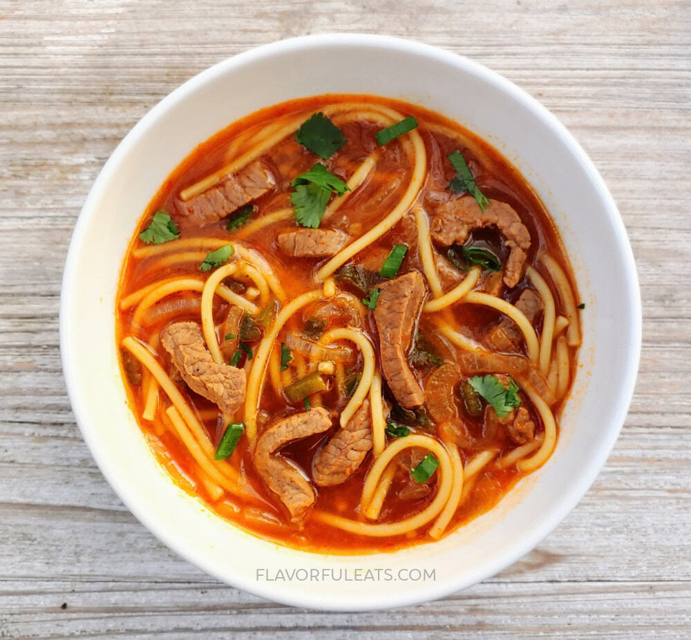 Spicy Beef Noodle Soup in white bowl.