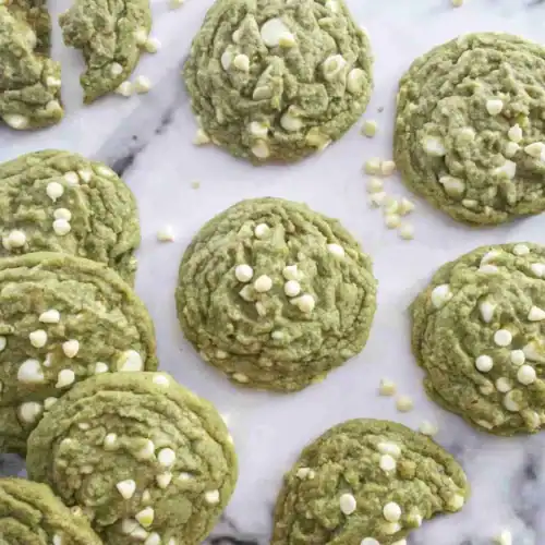 Matcha White Chocolate Chip Cookies on baking paper.
