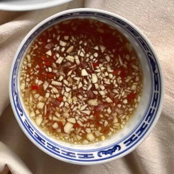 Vietnamese chili garlic sauce in a blue and white bowl.