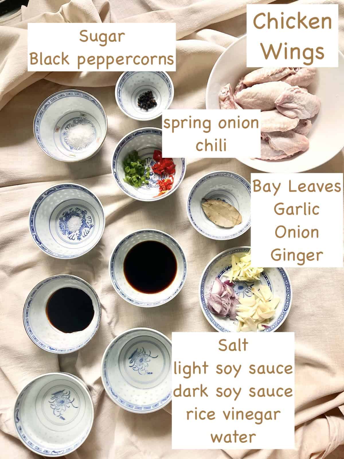 The ingredients for chicken wings adobo in bowls.