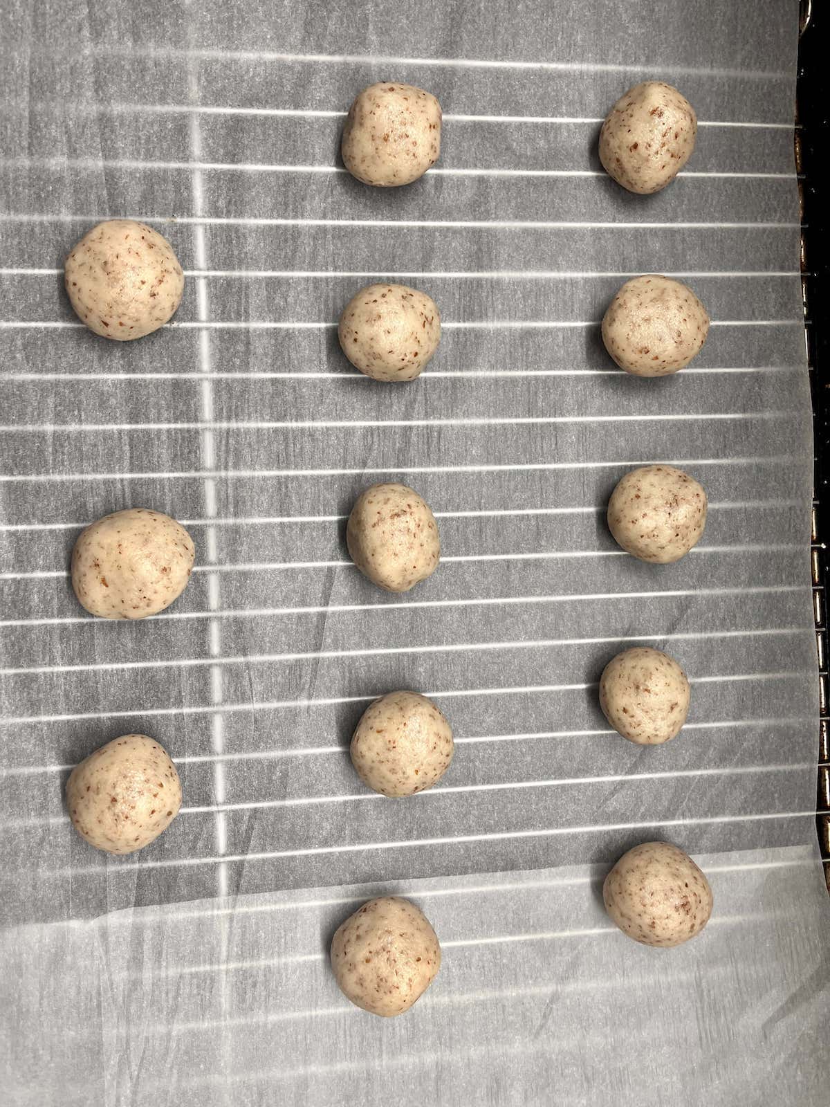 Almond cookie on a wire tray before baking.