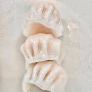 3 pieces of Chinese prawn dumplings (Har Gao) on a plate.