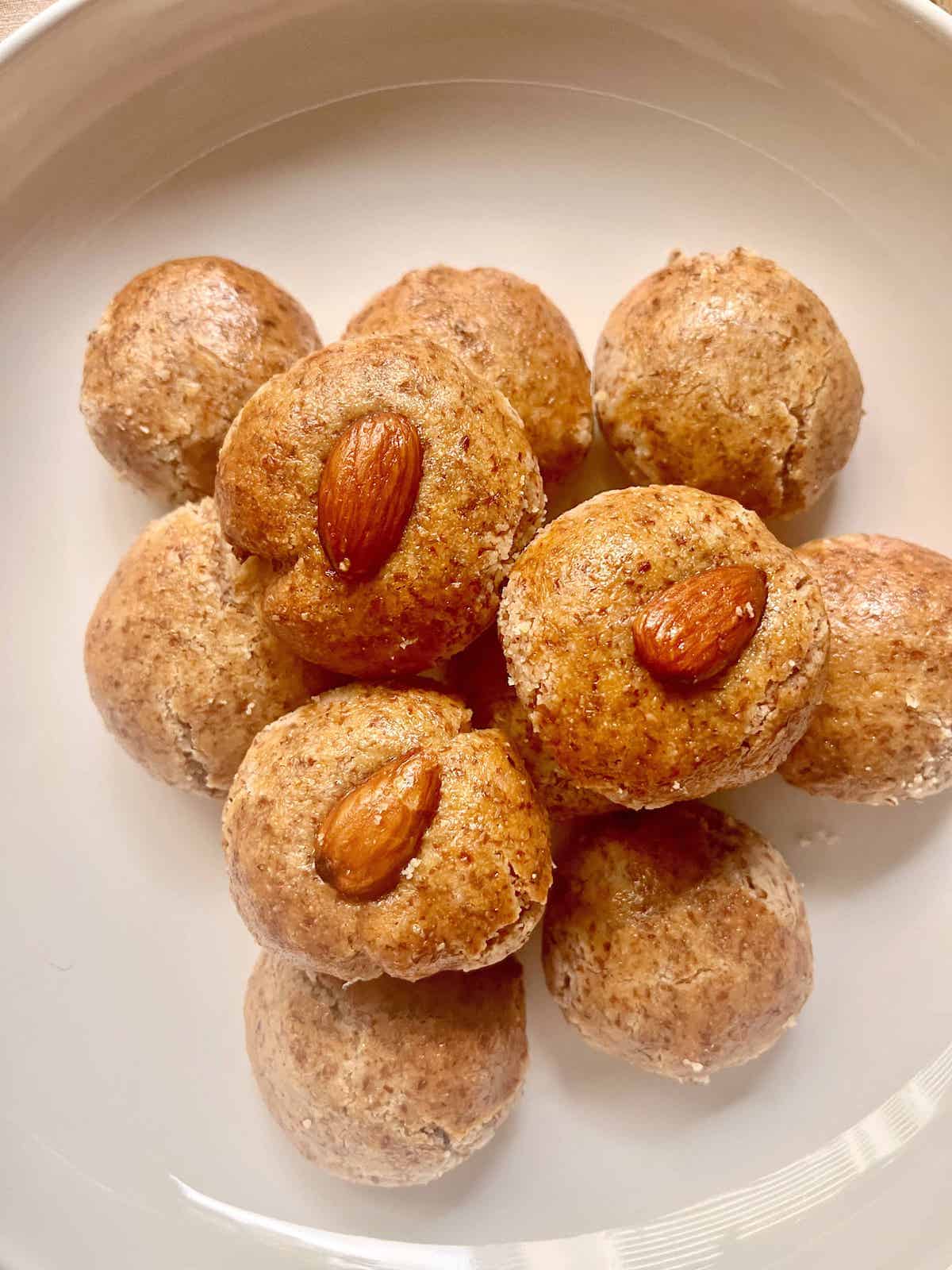 Easy traditional Chinese Almond Cookies on a white plate.