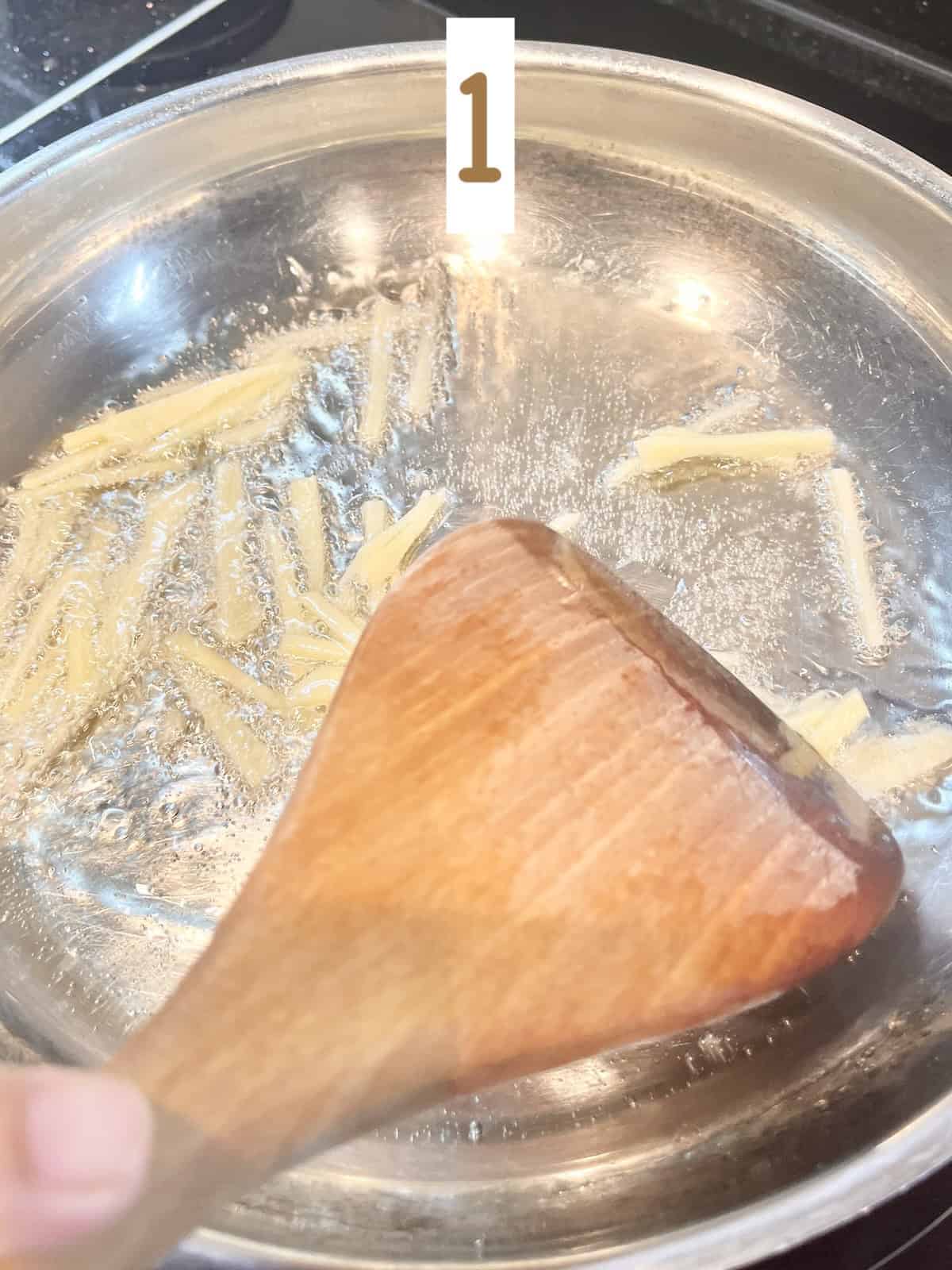 Stir frying ginger.