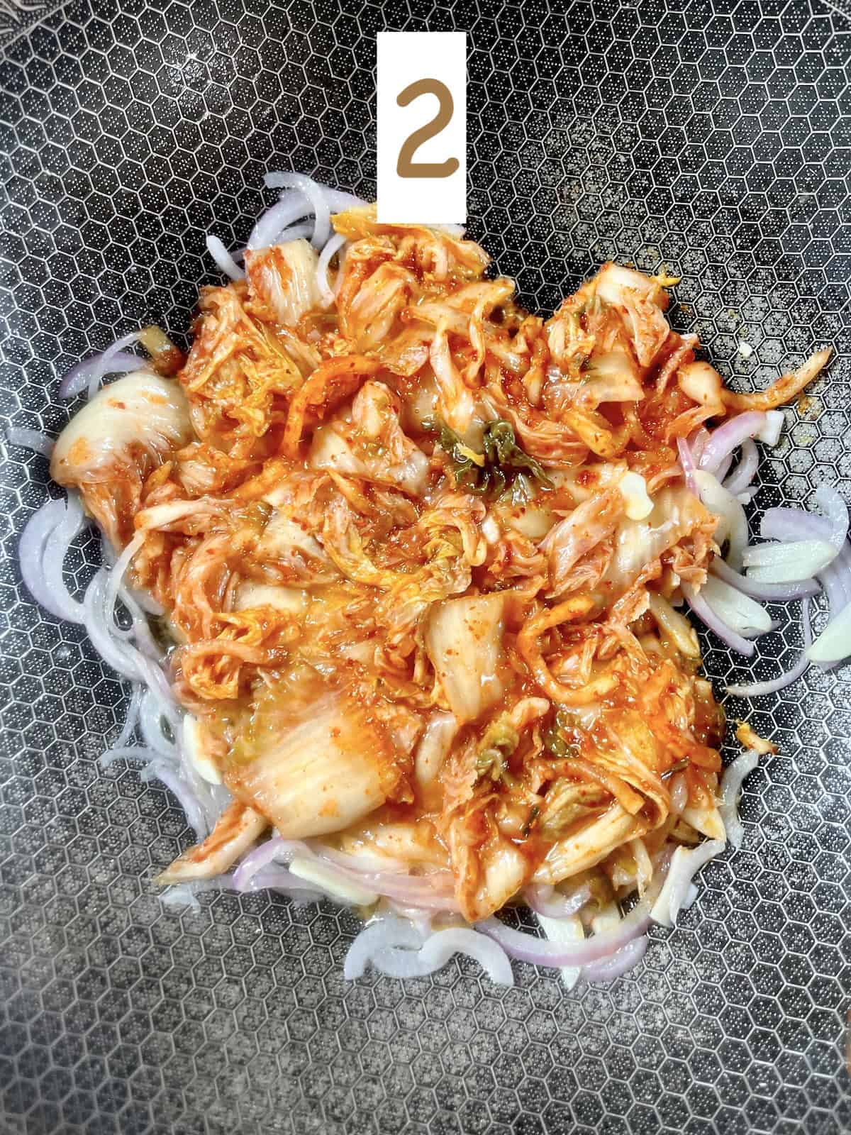 Stir frying kimchi.