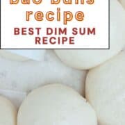 Fluffy bao buns in a steamer with "sweet bao buns recipe" written on top.