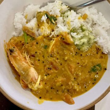 A bowl of South Indian Prawn curry and rice.