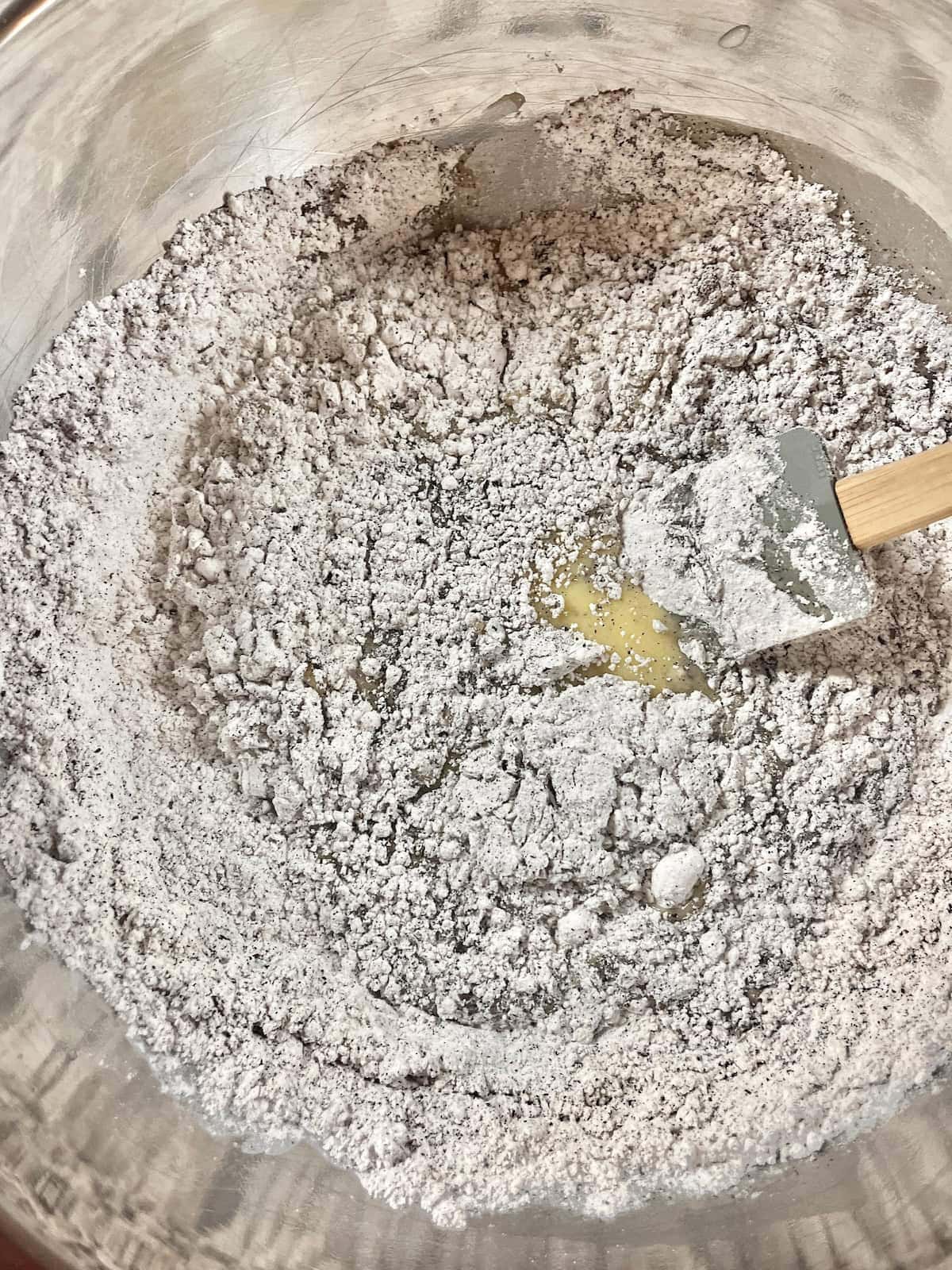 Mixing the dry and wet ingredients for oolong tea cake.